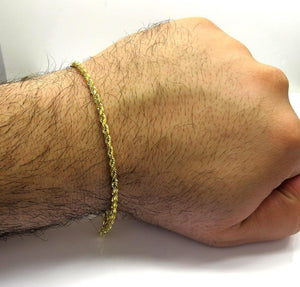 gold rope chain bracelet on hand