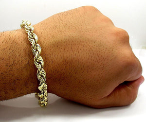 gold rope chain bracelet on hand