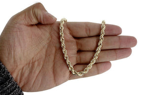 gold rope chain bracelet on hand